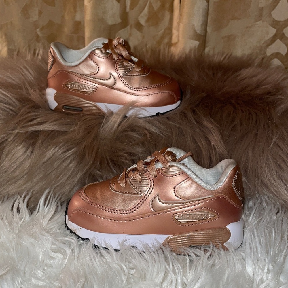 Pair of rose gold Nike
